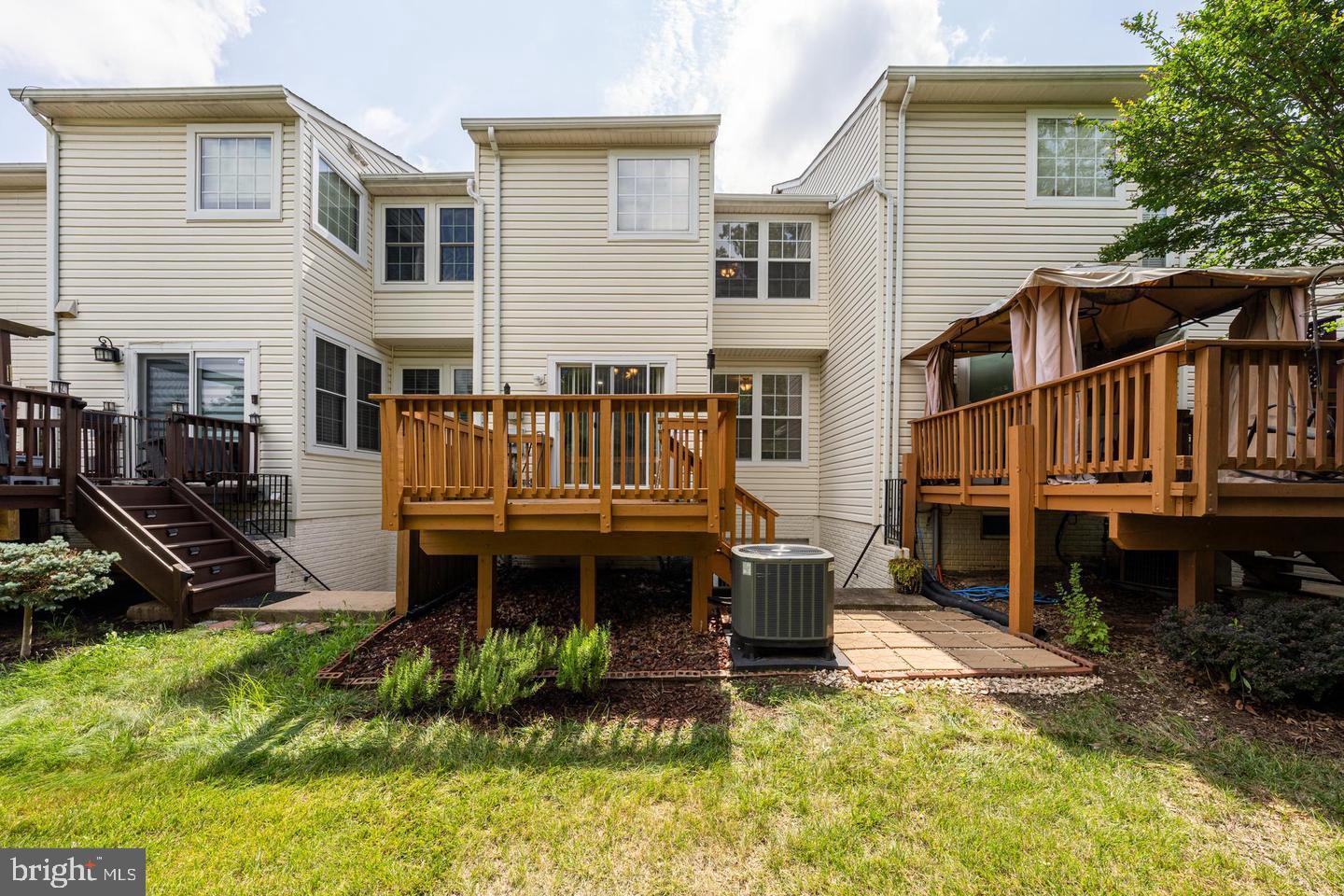 43122 Forest Edge Square Broadlands, VA 20148 - Photo 12 of 24 a view of house with wooden deck and furniture