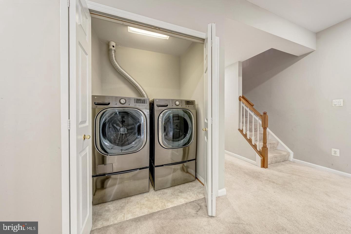 43122 Forest Edge Square Broadlands, VA 20148 - Photo 20 of 24 a utility room with dryer and washer