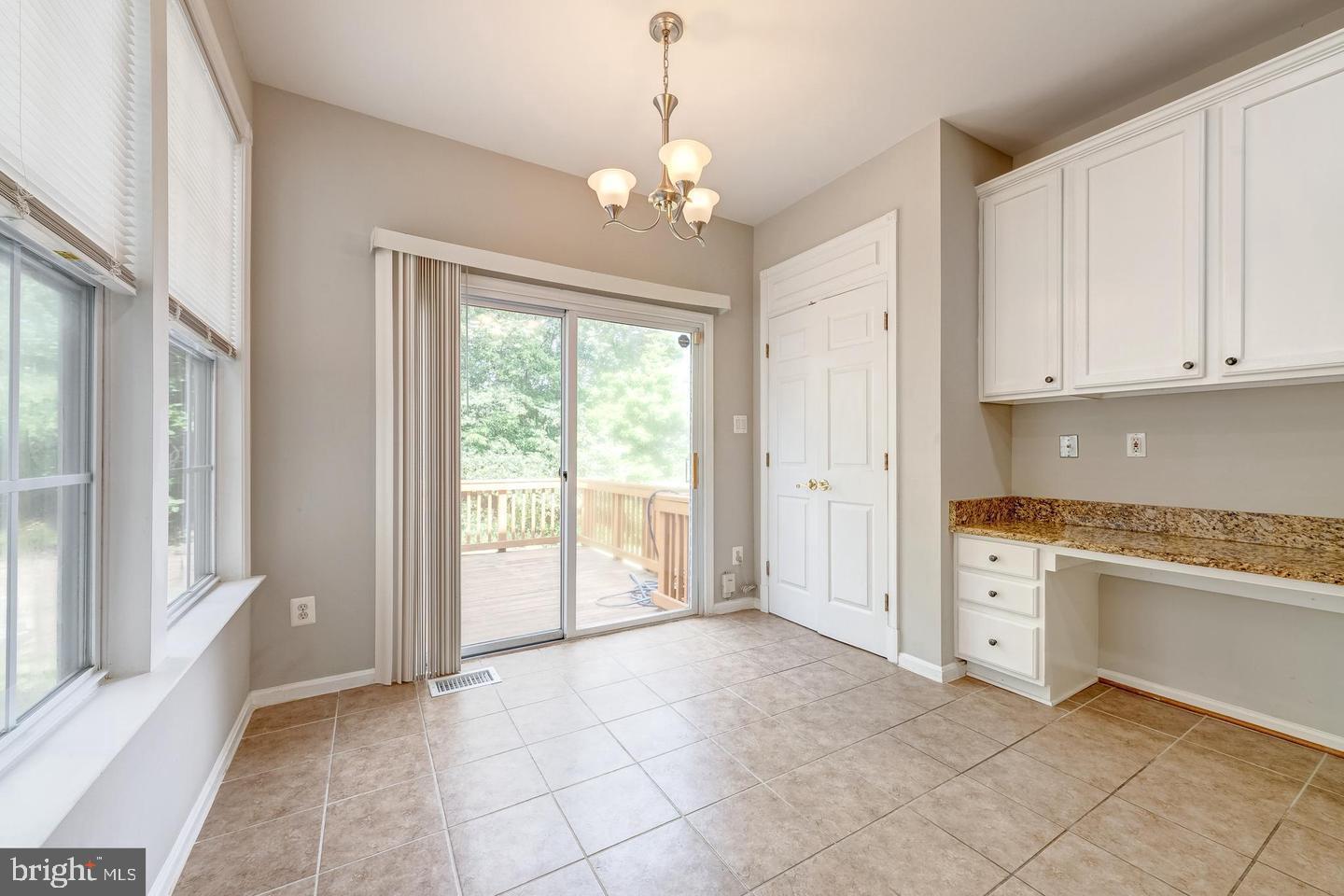43122 Forest Edge Square Broadlands, VA 20148 - Photo 10 of 24 a view of an empty room with window and cabinet