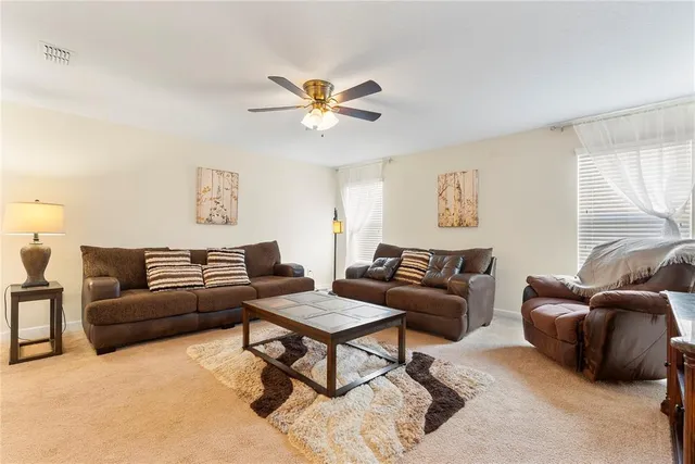 a living room with furniture and a couch