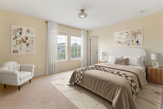 a bedroom with a bed and a couch