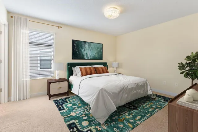 a bedroom with bed and window