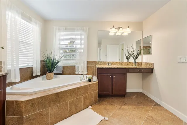 a bathroom with a sink double vanity and a mirror