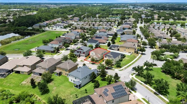 an aerial view of residential house with outdoor space and river