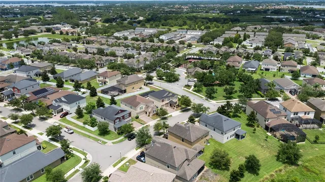 an aerial view of a city with lots of residential buildings