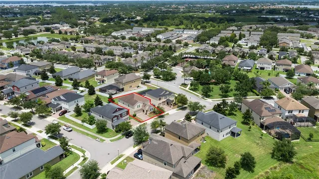 an aerial view of a house with a garden