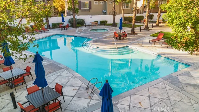a view of swimming pool with outdoor seating