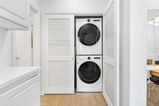 a view of a hallway with washer and dryer