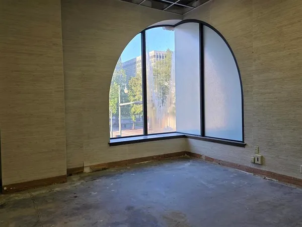 a view of a room has a large window