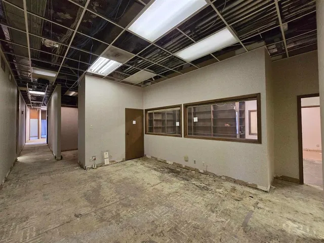 a view of hallway with windows