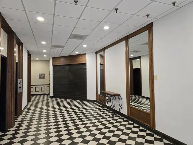 a bathroom with a glass door shower
