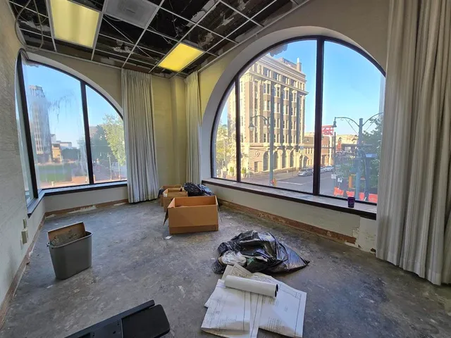 a view of a room has a large window