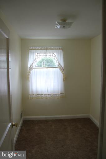 2211 Hawthorne Road Baltimore, MD 21220 - Photo 3 of 10 an empty room with a window