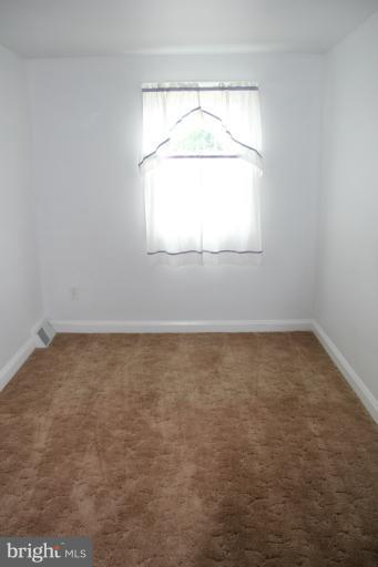 2211 Hawthorne Road Baltimore, MD 21220 - Photo 4 of 10 an empty room with a window