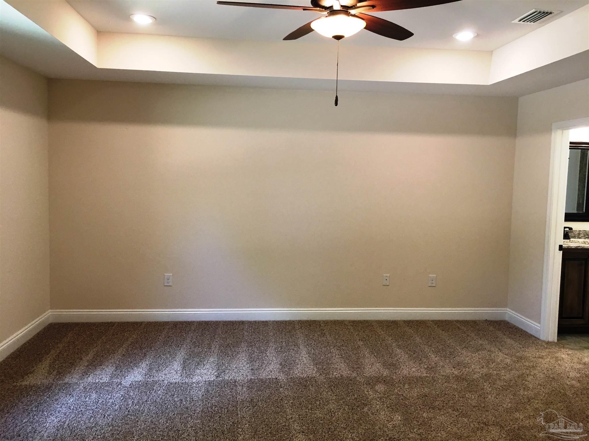 5308 South A Jones Road Milton, FL 32583 - Photo 13 of 27 Master bedroom has a box ceiling w/fan/light.