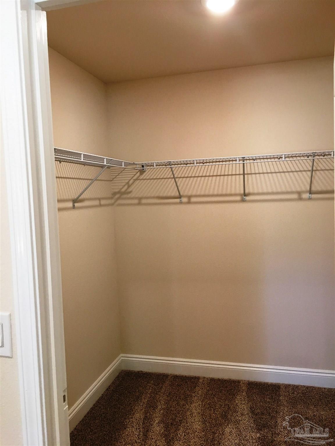 5308 South A Jones Road Milton, FL 32583 - Photo 14 of 27 Large walk-in master bedroom closet is seen here.