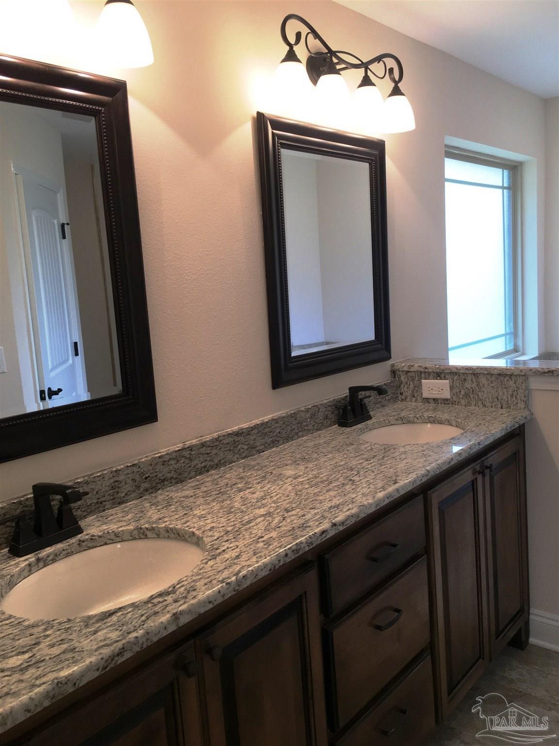 5308 South A Jones Road Milton, FL 32583 - Photo 15 of 27 Master bath features a dual sink vanity top.