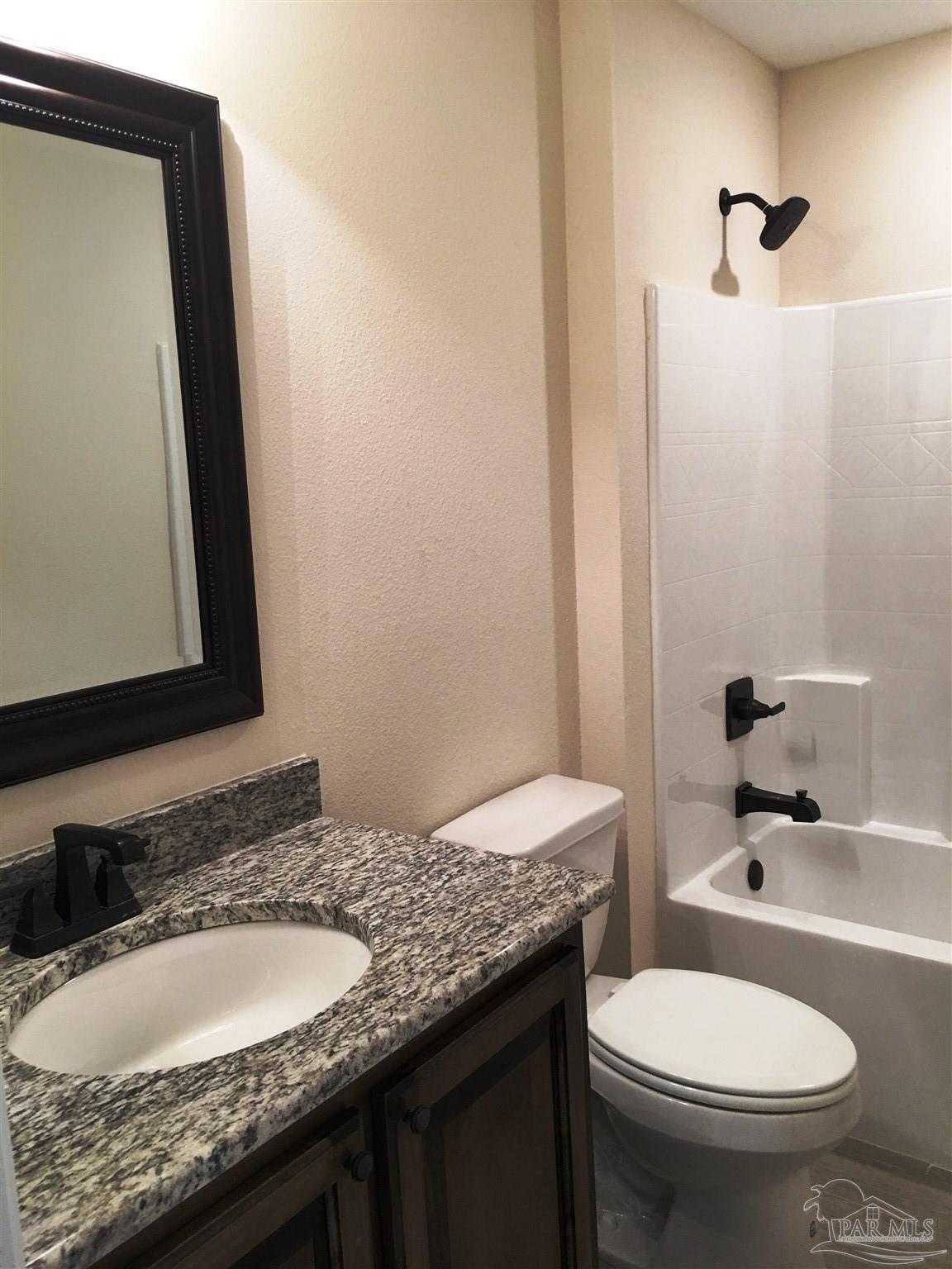 5308 South A Jones Road Milton, FL 32583 - Photo 20 of 27 A 2nd full bath features a shower/tub combination.