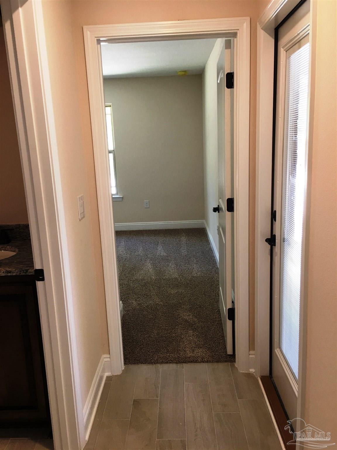 5308 South A Jones Road Milton, FL 32583 - Photo 22 of 27 Rear hall leads to 2 bedrooms & 1 bath.