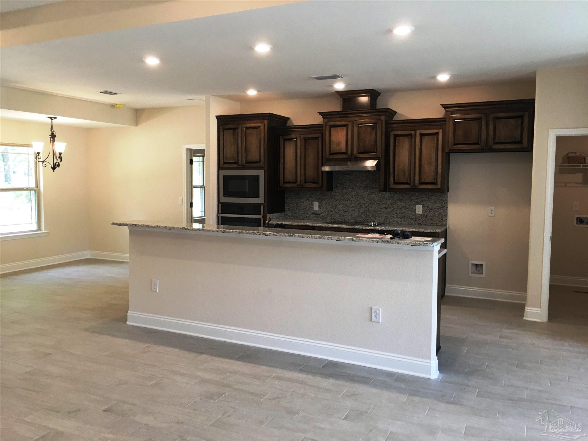 5308 South A Jones Road Milton, FL 32583 - Photo 4 of 27 A view from living to kitchen is shown here.