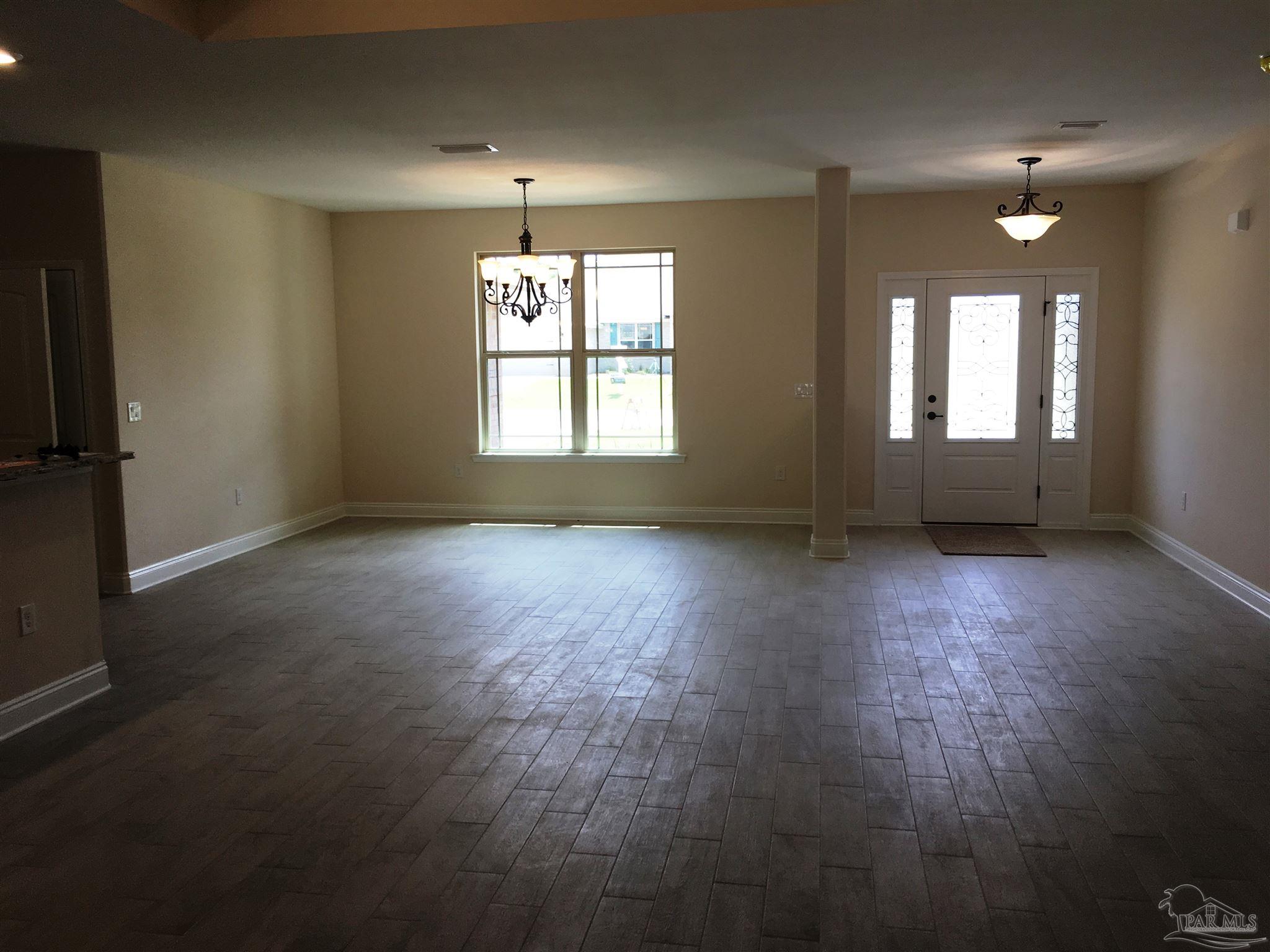 5308 South A Jones Road Milton, FL 32583 - Photo 5 of 27 Here's a view from living to dining/foyer.