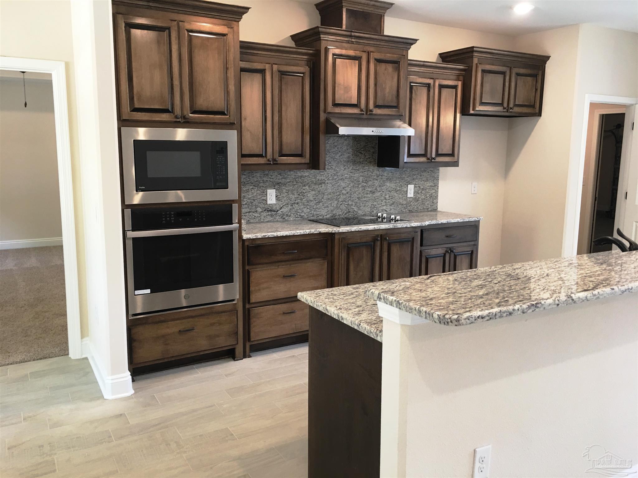5308 South A Jones Road Milton, FL 32583 - Photo 6 of 27 Kitchen has a wall oven & separate cooktop.