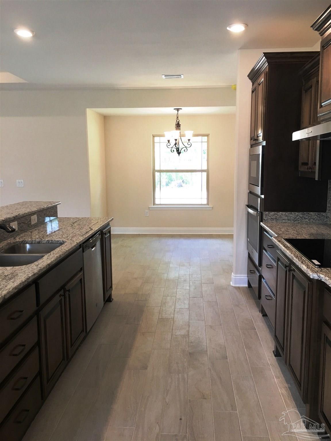 5308 South A Jones Road Milton, FL 32583 - Photo 10 of 27 Here's a view from kitchen to breakfast nook.