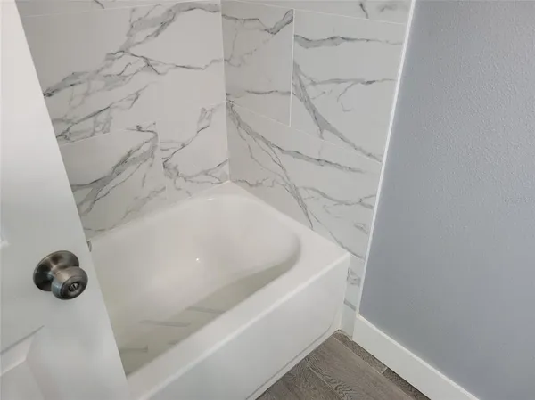 a bathroom with a bathtub