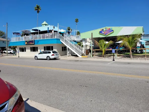 a view of a street with cars