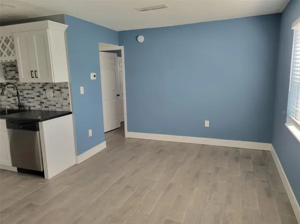 an empty room with mirror