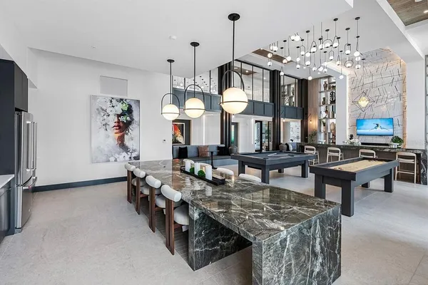 a very nice looking living room with furniture and a chandelier