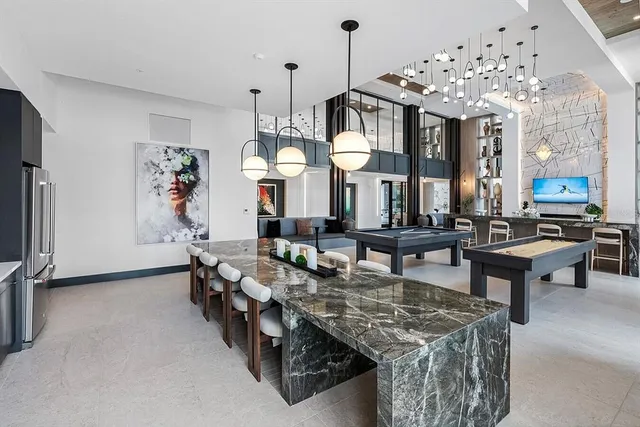 a very nice looking living room with furniture and a chandelier