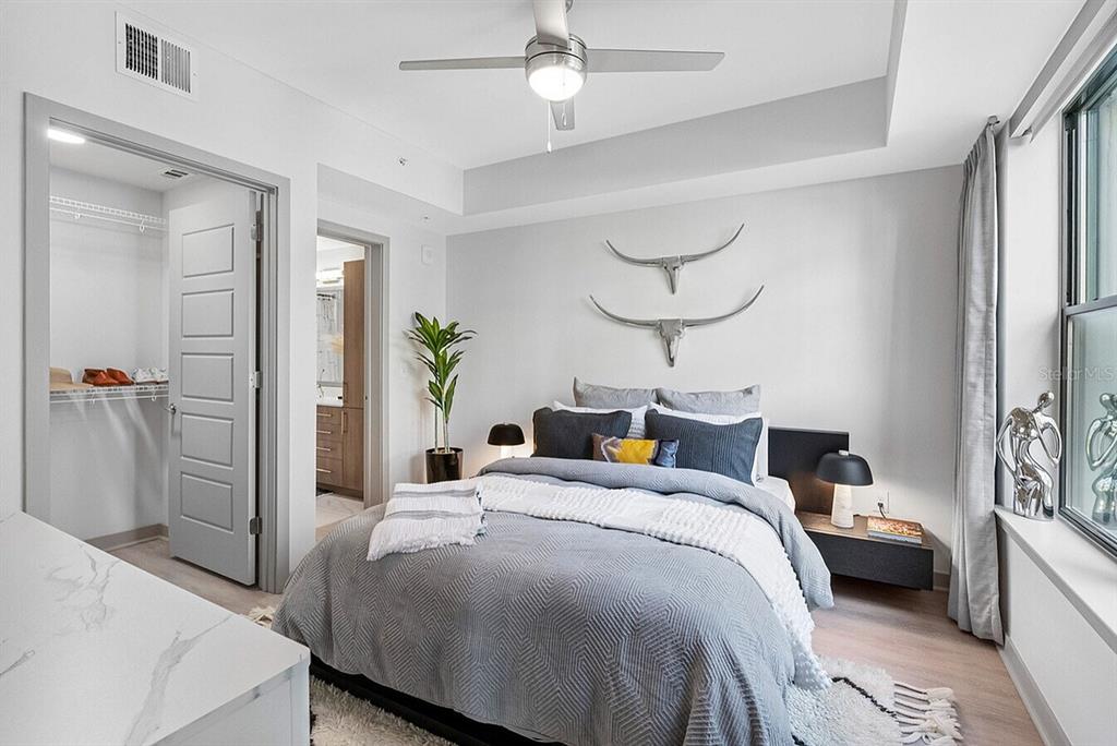 425 Centerpointe Circle, Unit S1 Altamonte Springs, FL 32701 - Photo 9 of 24 a bedroom with a bed and a chandelier