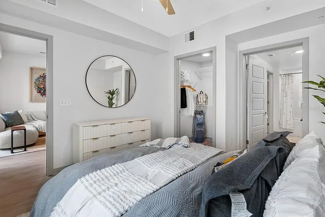 a bedroom with a bed and a dresser