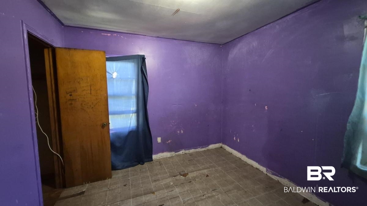 2207 Roberta Drive Mobile, AL 36617 - Photo 11 of 14 Empty room with baseboards