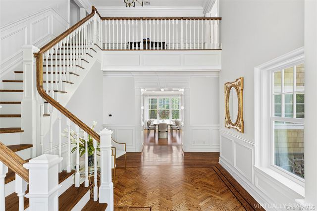 a view of entryway with wooden floor