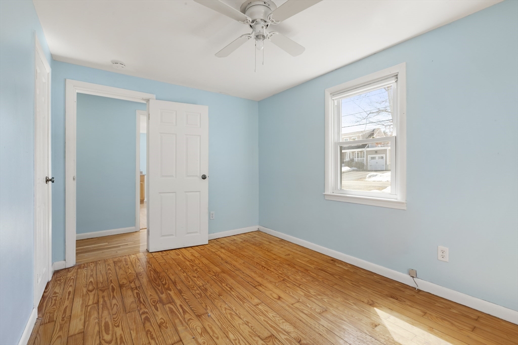 21 River Road Marion, MA 02738 - Photo 16 of 29 a view of a room with a ceiling fan and a window