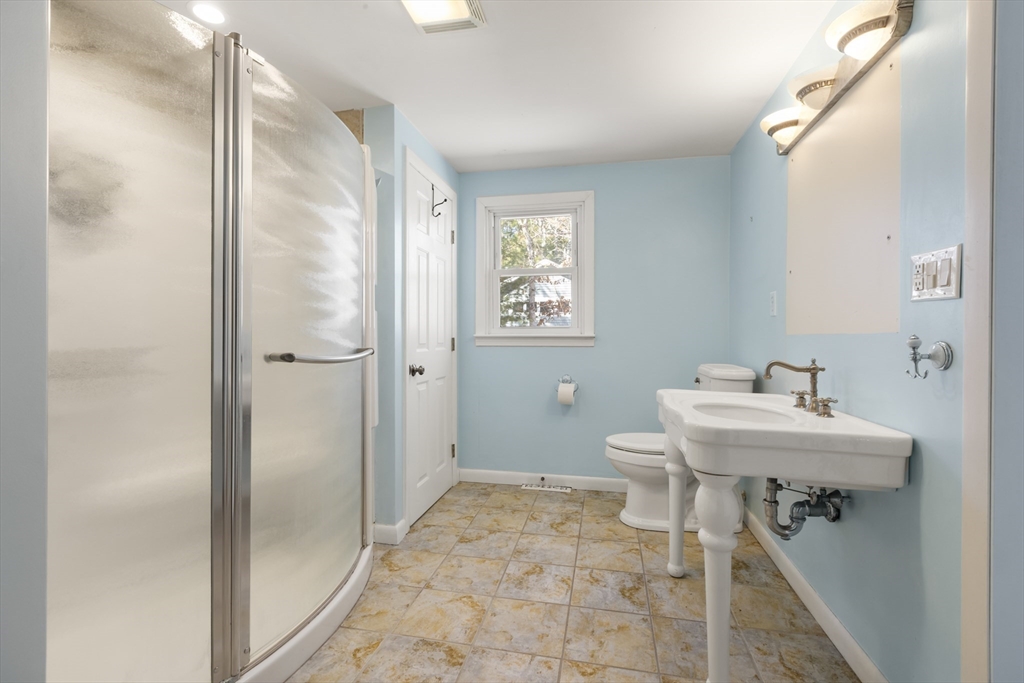 21 River Road Marion, MA 02738 - Photo 17 of 29 a bathroom with a sink a toilet and shower