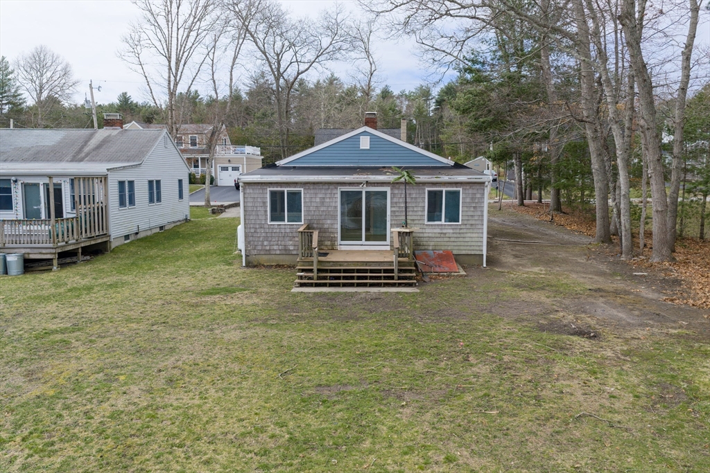 21 River Road Marion, MA 02738 - Photo 18 of 29 a front view of a house with a yard