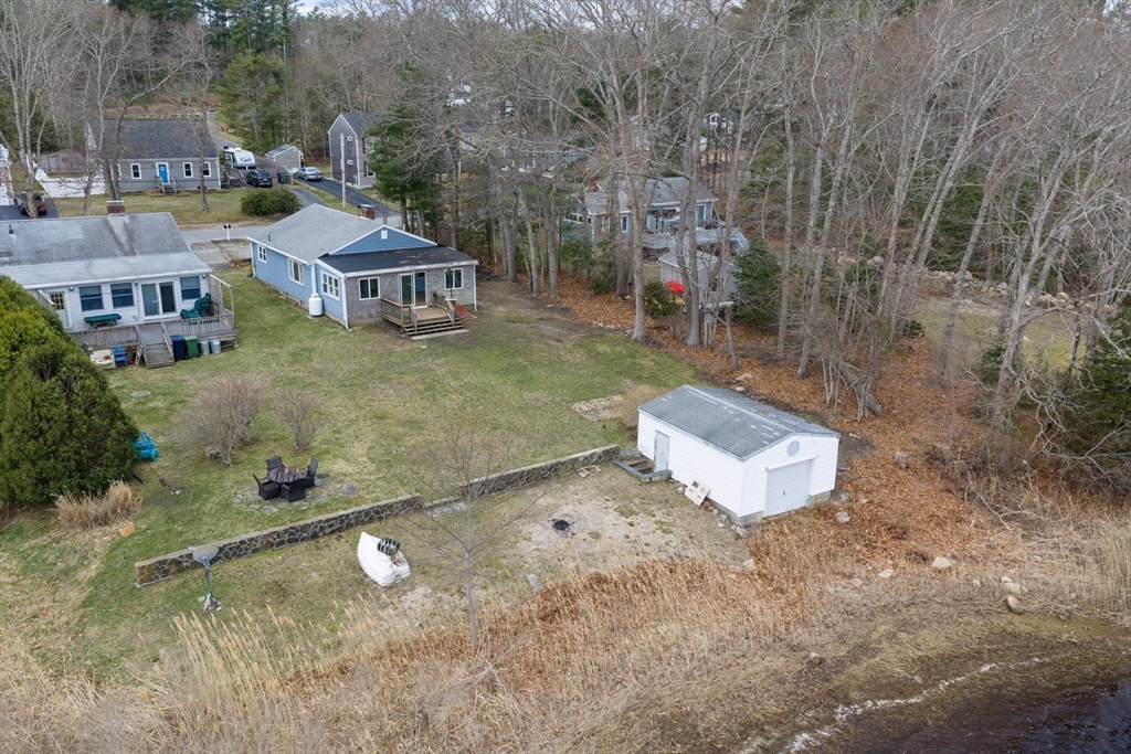 21 River Road Marion, MA 02738 - Photo 20 of 29 a view of a house with a backyard