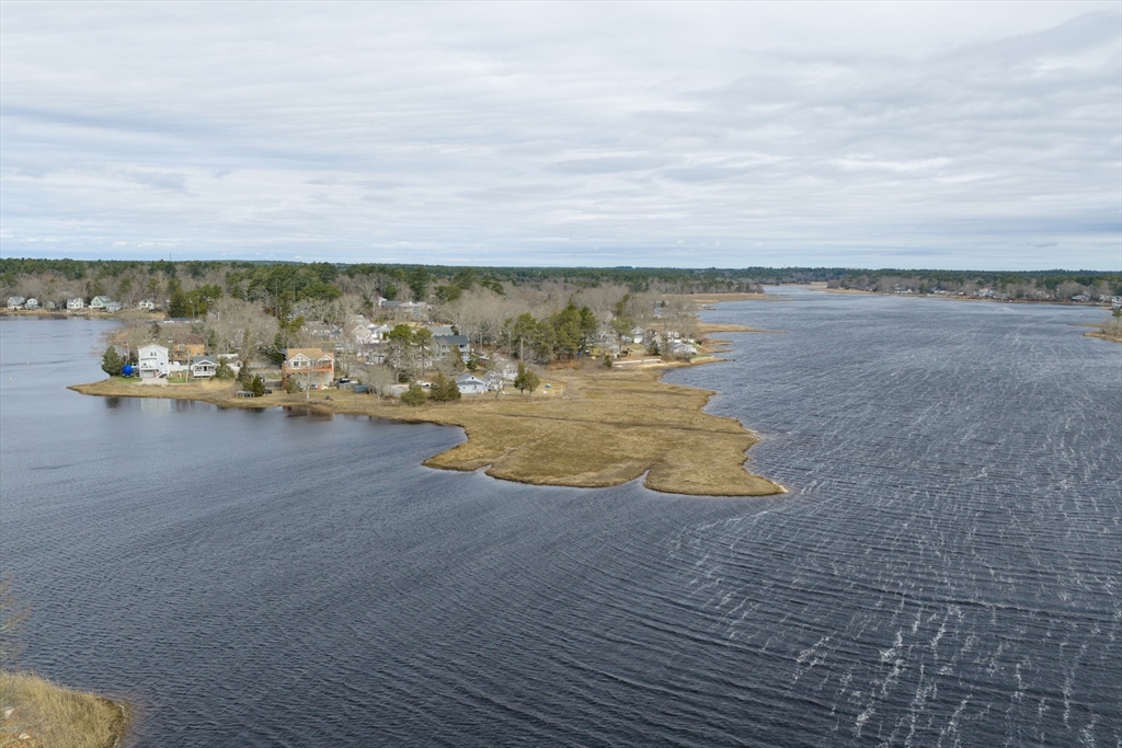 21 River Road Marion, MA 02738 - Photo 2 of 29 a view of a lake with beach