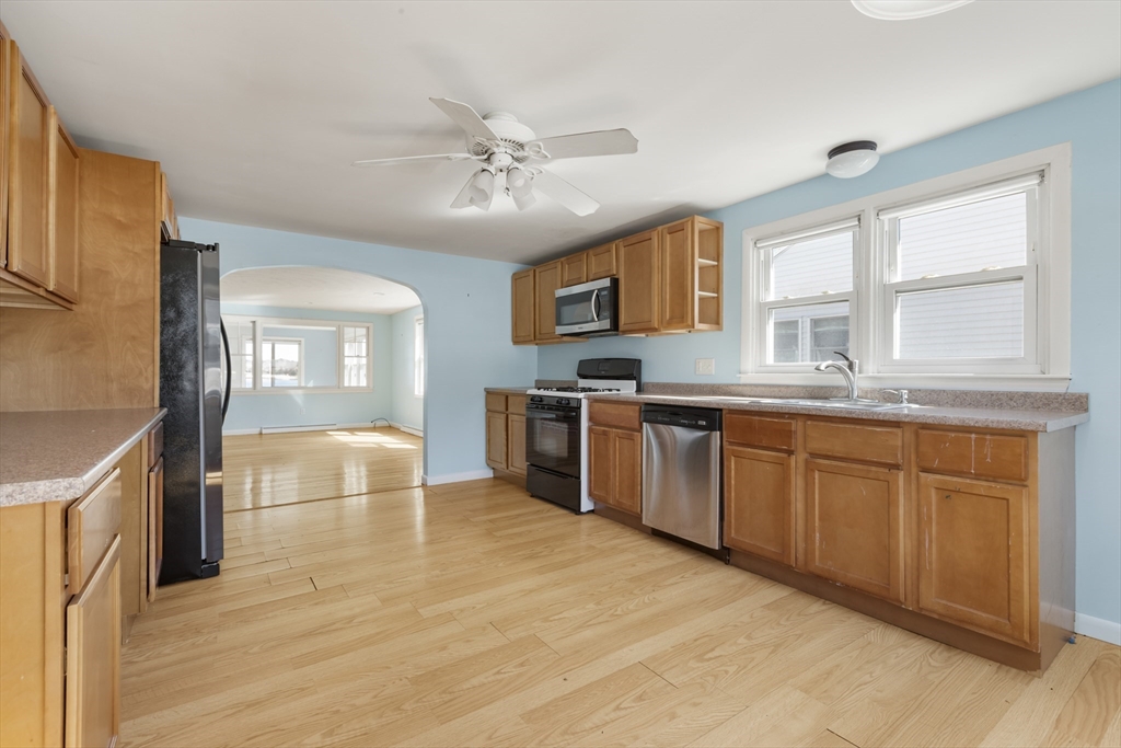 21 River Road Marion, MA 02738 - Photo 5 of 29 a large kitchen with stainless steel appliances granite countertop a stove a sink dishwasher and a refrigerator
