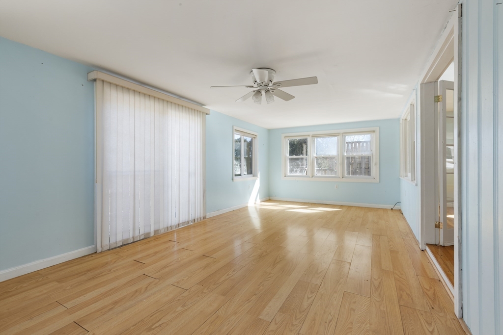 21 River Road Marion, MA 02738 - Photo 10 of 29 a view of an empty room with a window and wooden floor