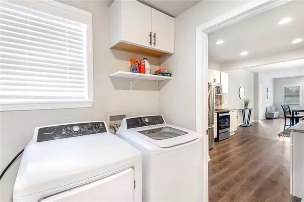a utility room with washer and dryer