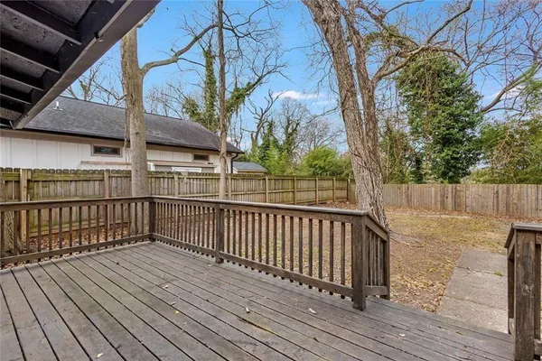 a view of deck with wooden floor and fence and floor