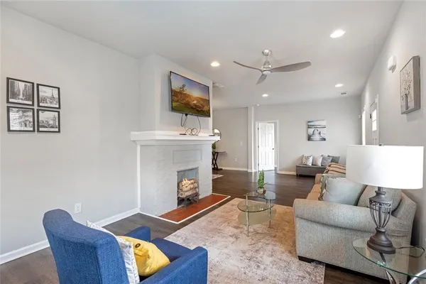 a living room with furniture and a fireplace