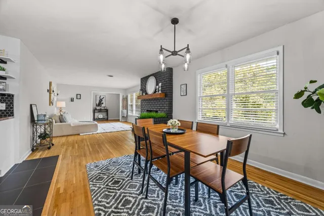 a view of a dining room with furniture window and wooden floor