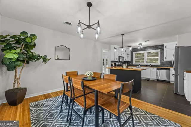 a view of a dining room with furniture