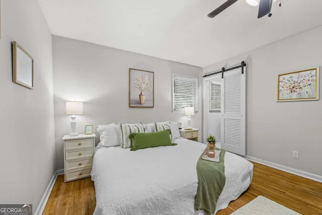 a bedroom with a bed and a couch