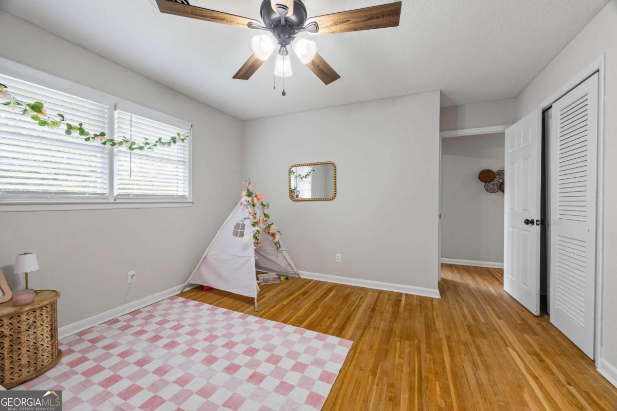 110 Valley Road Toccoa, GA 30577 - Photo 29 of 39 a view of a room with wooden floor and ceiling fan